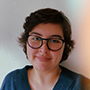 Librarian Madeline Robert smiles at the camera