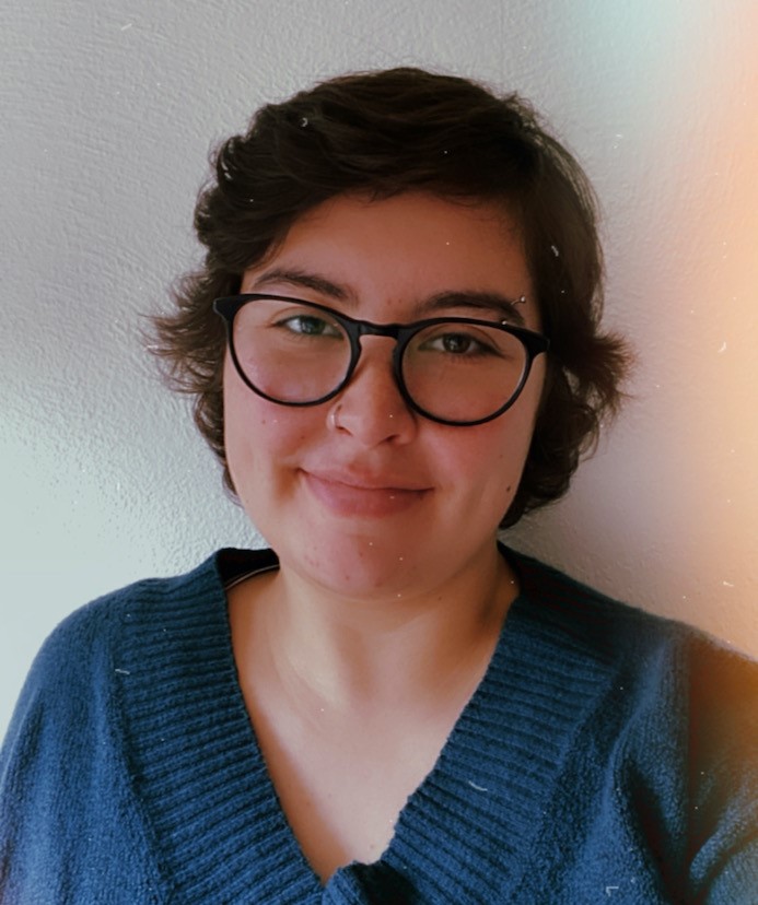 Librarian Madeline Robert smiles at the camera